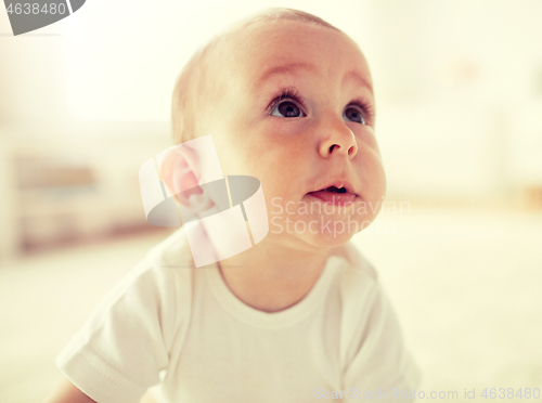 Image of close up of happy little baby boy or girl at home