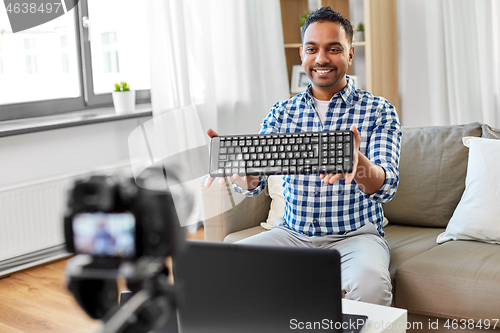 Image of male video blogger with keyboard videoblogging