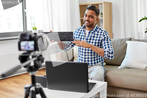 Image of male video blogger with keyboard videoblogging