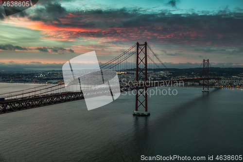 Image of Bridge of 25th April with cars after sunset