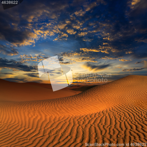 Image of sand dunes in desert at sunset