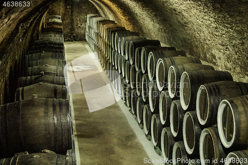 Image of barrel filled with wine in wine cellar