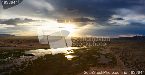 Image of Sand dunes Bayan Gobi and lake at sunset