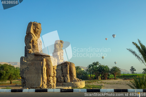 Image of Colossi of Memnon statues and balloons