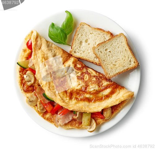 Image of omelette stuffed with vegetables and ham