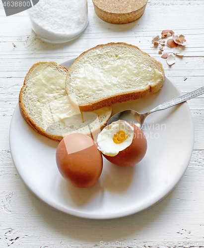 Image of boiled eggs and bread with butter