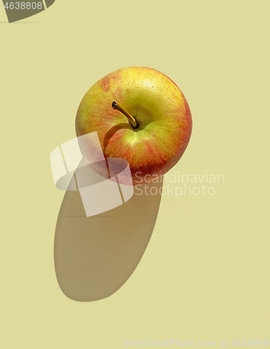 Image of fresh apple with long shadow