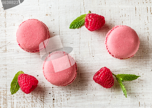 Image of pink macaroons on wooden table