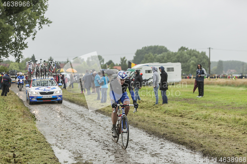 Image of The Cyclist Mickael Delage on a Cobblestone Road - Tour de Franc