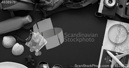 Image of Travel and Tourist concept. Vacation and travel accessories placed on black background.