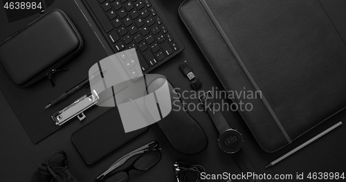 Image of Business concept. Flat lay composition with various black gadgets on dark black surface