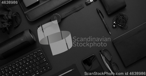 Image of Business concept. Flat lay composition with various black gadgets on dark black surface