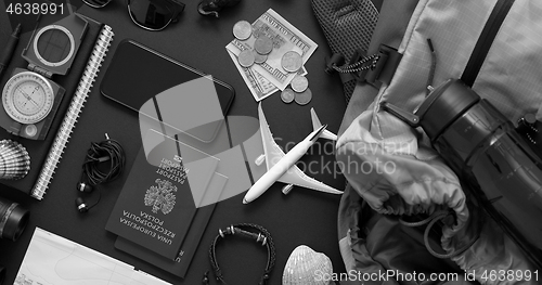 Image of Travel and Tourist concept. Vacation and travel accessories placed on black background.