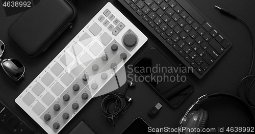 Image of Audio producer concept. Various digital recording audio music gadgets placed on black background.