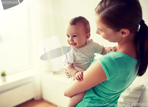 Image of happy young mother with little baby at home