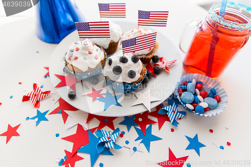 Image of cupcakes with american flags on independence day