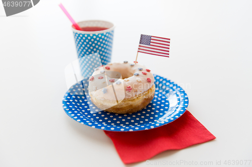 Image of donut with juice and american flag decoration