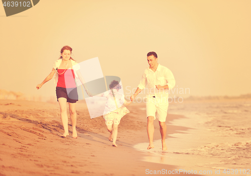 Image of happy young family have fun on beach