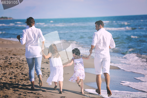 Image of happy young  family have fun on beach