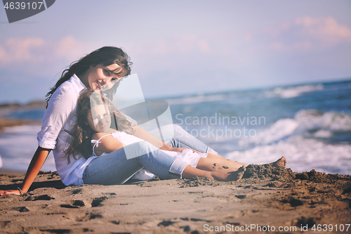 Image of mom and daughter portrait on beach