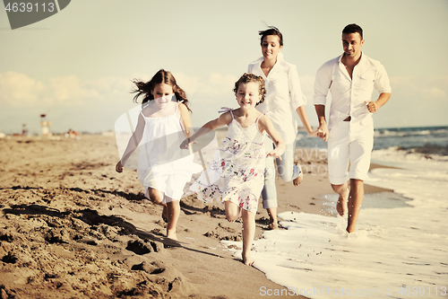 Image of happy young  family have fun on beach
