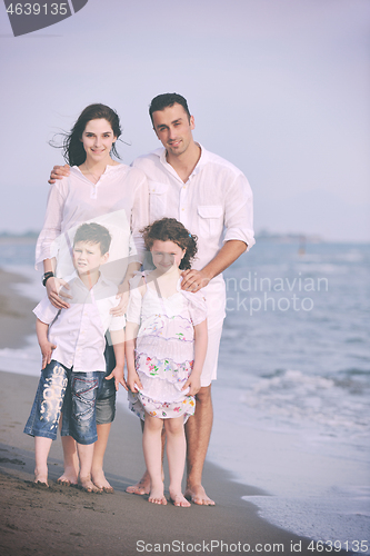 Image of happy young family have fun on beach