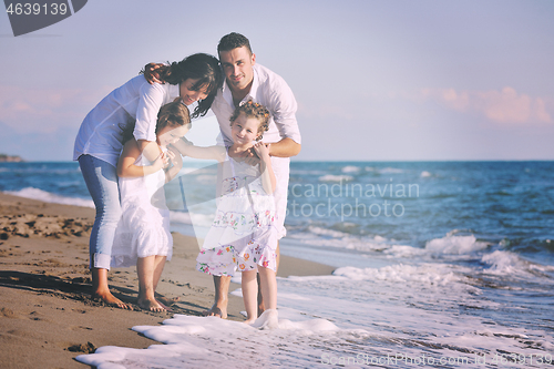 Image of happy young  family have fun on beach
