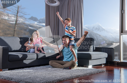 Image of Happy family playing a video game