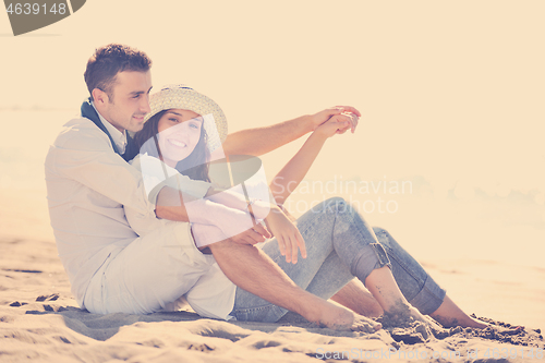 Image of happy young couple have fun at beautiful beach