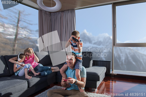 Image of Happy family playing a video game