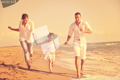 Image of happy young  family have fun on beach