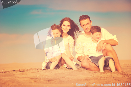 Image of happy young family have fun on beach