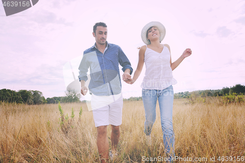 Image of happy young couple have romantic time outdoor