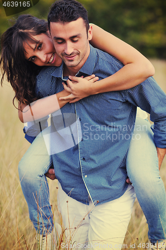 Image of happy young couple have romantic time outdoor