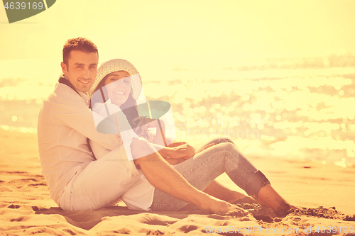 Image of happy young couple have fun at beautiful beach