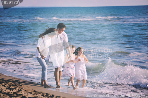 Image of happy young  family have fun on beach