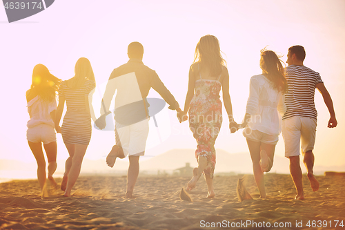 Image of happy young  people group have fun on beach