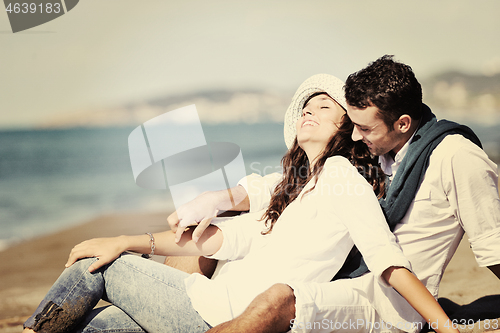 Image of happy young couple have fun at beautiful beach