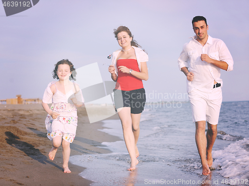 Image of happy young family have fun on beach