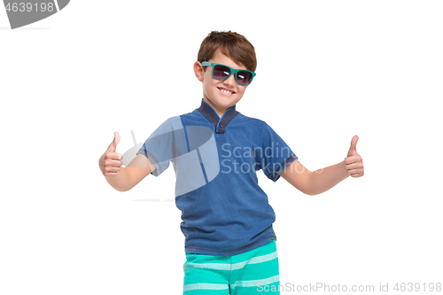 Image of Full length portrait of cute little kid in stylish clothes looking at camera and smiling