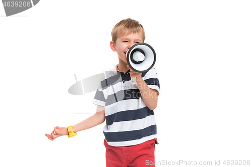 Image of Little cute kid baby boy holding in hand and speaking in electronic gray megaphone