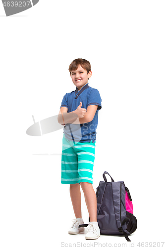 Image of Full length portrait of cute little kid in stylish clothes looking at camera and smiling