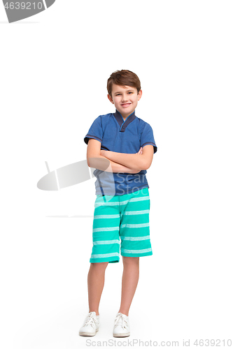 Image of Full length portrait of cute little kid in stylish clothes looking at camera and smiling