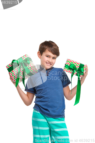 Image of Full length portrait of cute little kid in stylish clothes looking at camera and smiling