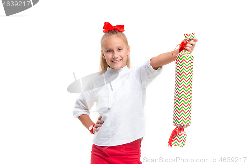 Image of Full length portrait of cute little kid in stylish clothes looking at camera and smiling