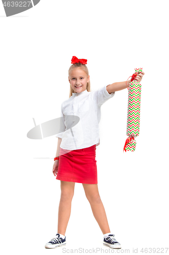 Image of Full length portrait of cute little kid in stylish clothes looking at camera and smiling