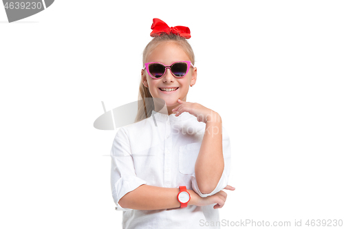 Image of Full length portrait of cute little kid in stylish jeans clothes looking at camera and smiling