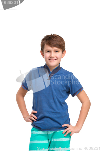 Image of Full length portrait of cute little kid in stylish clothes looking at camera and smiling