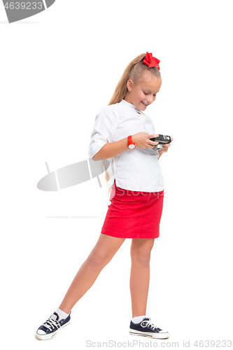 Image of Full length portrait of cute little kid in stylish clothes with retro camera