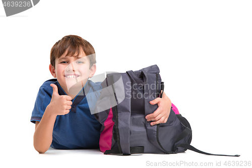Image of Full length portrait of cute little kid in stylish clothes looking at camera and smiling